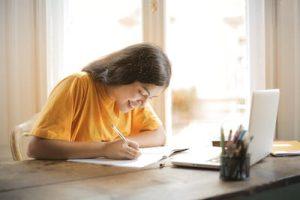 A student writing application letter to Colleges that accept WGU credits